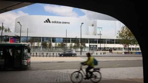 A cyclist rides past the Adidas Arena, April 18, 2024, in Paris, France. (Thomas Padilla/AP)