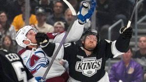 Colorado Avalanche left wing Gabriel Landeskog, left, and Los Angeles Kings right wing Joel Armia reach for the puck during the first period of Game 3 in the first round of the NHL hockey Stanley Cup playoffs Thursday, April 23, 2026, in Los Angeles. (Mark J. Terrill/AP Photo)