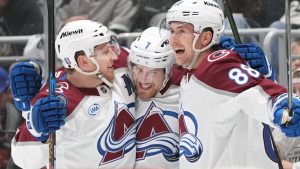 Colorado Avalanche's Devon Toews celebrates his goal with Nathan MacKinnon and Martin Necas against the Los Angeles Kings during the third period of Game 4 in the first round of an NHL Stanley Cup playoff series Sunday, April 26, 2026, in Los Angeles. (AP/Scott Strazzante)