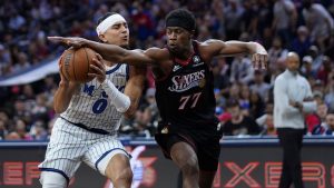 Orlando Magic's Anthony Black, left, tries to get past Philadelphia 76ers' Vj Edgecombe during the first half of an NBA play-in tournament basketball game Wednesday, April 15, 2026, in Philadelphia. (Matt Slocum/AP)