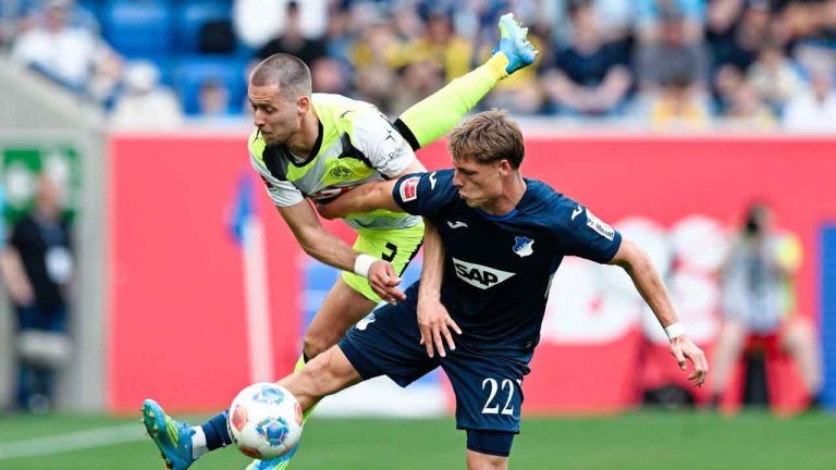 Dortmund's Waldemar Anton, left, and Hoffenheim's Alexander Prass battle for the ball during their German Bundesliga soccer match in Sinsheim. (Uwe Anspach/AP)