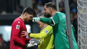 Bosnian goalkeeper Nikola Vasilj, left, and Italy goalkeeper Gianluigi Donnarumma argue during a penalty shootout during the World Cup qualifying playoff final soccer match between Bosnia and Italy. (Armin Durgut/AP)