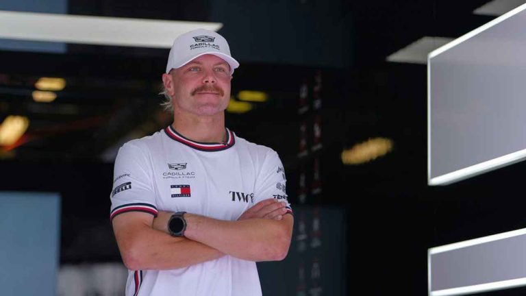  Cadillac driver Valtteri Bottas, of Finland, poses in his team garage ahead of the Australian Formula One Grand Prix at Albert Park, in Melbourne. (Asanka Brendon Ratnayake/AP)