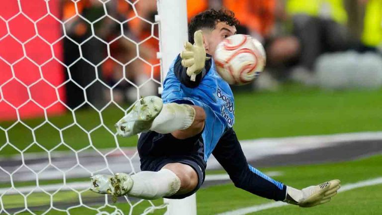 Real Sociedad's goalkeeper Unai Marrero makes a save during during the penalty shoot out at the Copa del Rey final soccer match between Atletico Madrid and Real Sociedad in Seville, Spain, Saturday, April. 18, 2026. (Jose Breton/AP)