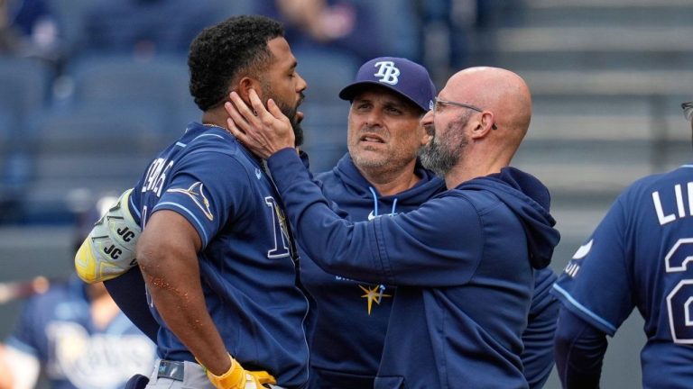 Tampa Bay Rays' Junior Caminero is checked out after being hit with a foul tip in the first inning of a baseball game against the Cleveland Guardians in Cleveland, Tuesday, April 28, 2026. (Sue Ogrocki/AP)