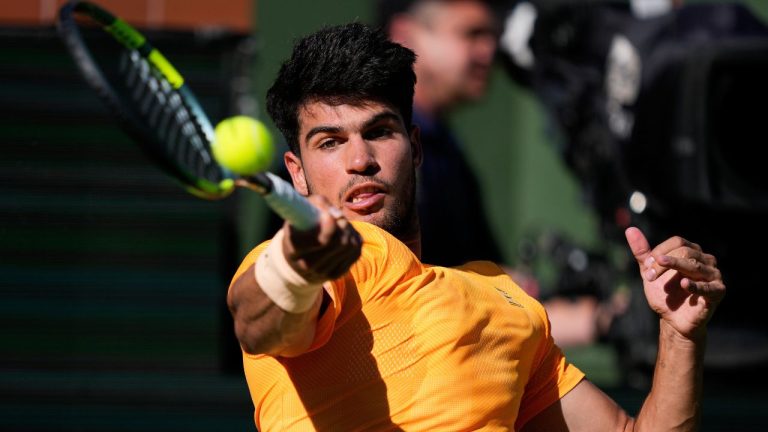 Carlos Alcaraz, of Spain, returns a shot against Daniil Medvedev, of Russia, during a semifinal match at the BNP Paribas Open tennis tournament, Saturday, March 14, 2026, in Indian Wells, Calif. (Mark J. Terrill/AP)