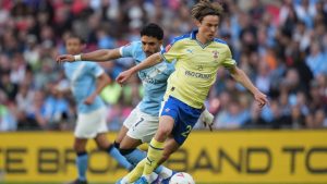 Southampton's Caspar Jander in action in front of Manchester City's Omar Marmoush during the FA Cup semifinal soccer match between Manchester City and Southampton in Manchester, England, Saturday, April 25, 2026. (Alastair Grant/AP)