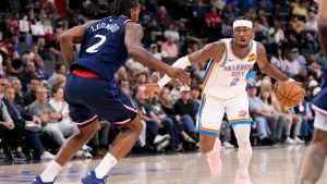 Oklahoma City Thunder guard Shai Gilgeous-Alexander, right, tries to get past Los Angeles Clippers forward Kawhi Leonard during the first half of an NBA basketball game Wednesday, April 8, 2026, in Inglewood, Calif. (Mark J. Terrill/AP)