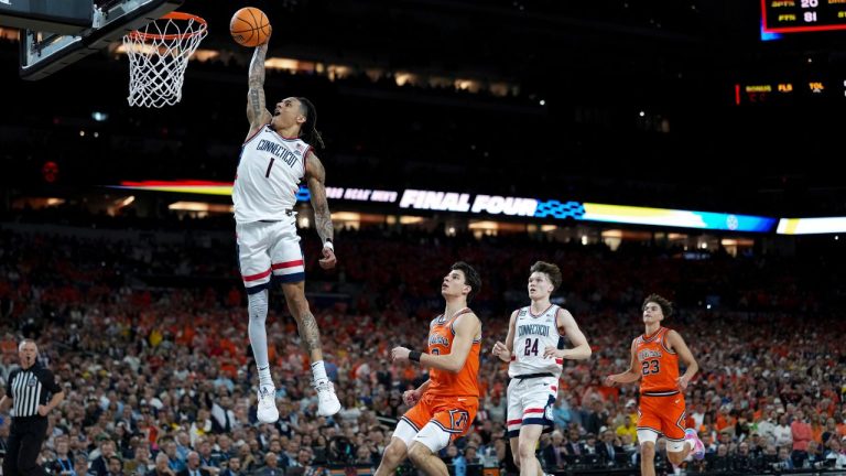 UConn guard Solo Ball (1) dunks against Illinois during the second half of an NCAA college basketball tournament semifinal game at the Final Four, Saturday, April 4, 2026, in Indianapolis. (Abbie Parr/AP)