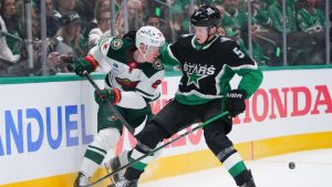 Dallas Stars defenceman Nils Lundkvist (5) defends against Minnesota Wild defenceman Jeff Petry (2) during the second period in Game 1 of a first-round NHL Stanley Cup playoffs hockey series, Saturday, April 18, 2026, in Dallas, Texas. (Julio Cortez/AP)