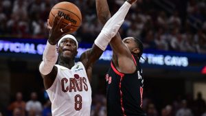 Cleveland Cavaliers guard Dennis Schroder goes to the basket against Toronto Raptors forward RJ Barrett during the second half in Game 5 of a first-round NBA playoffs basketball series, Wednesday, April 29, 2026, In Cleveland. (David Dermer/AP)
