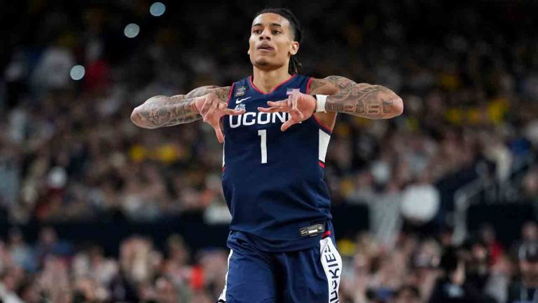 UConn guard Solo Ball celebrates a basket against Michigan during the first half of the NCAA college basketball tournament national championship game at the Final Four, Monday, April 6, 2026, in Indianapolis. (Abbie Parr/AP)