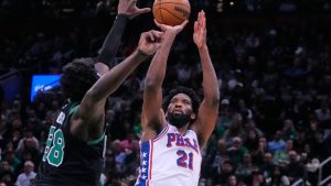 Philadelphia 76ers centre Joel Embiid (21) takes a shot over Boston Celtics centre Neemias Queta (88) during the second half of Game 5 of a first-round NBA playoffs basketball series, Tuesday, April 28, 2026, in Boston. (Charles Krupa/AP)