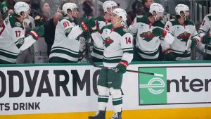 Minnesota Wild center Joel Eriksson Ek (14) skates by his bench after scoring a power play goal against the Dallas Stars during the first period in Game 1 of a first-round NHL Stanley Cup playoffs hockey series, Saturday, April 18, 2026, in Dallas, Texas. (Julio Cortez/AP)