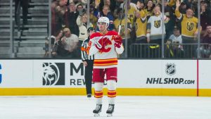 Calgary Flames defenceman Zach Whitecloud, center, salutes the fans during the first period of an NHL hockey game against the Vegas Golden Knights, Thursday, April 2, 2026, in Las Vegas. (Candice Ward/AP)