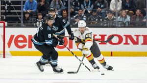 Vegas Golden Knights left wing Ivan Barbashev (49) goes after the puck against Utah Mammoth center Nick Schmaltz (8) during the first period of Game 3 of the first round in an NHL hockey Stanley Cup playoff series, Friday, April 24, 2026, in Salt Lake City. (Melissa Majchrzak/AP)
