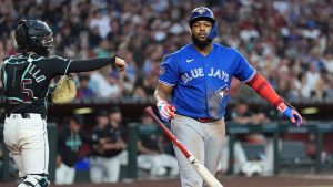 Toronto Blue Jays' Vladimir Guerrero Jr., right, tosses his bat after striking out as Arizona Diamondbacks catcher Adrian Del Castillo throws the baseball during the seventh inning of a baseball game, Saturday, April 18, 2026, in Phoenix. (Ross D. Franklin/AP Photo)