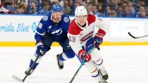 Montréal Canadiens right wing Cole Caufield (13) beats Tampa Bay Lightning center Zemgus Girgensons (28) up the ice during the first period of an NHL hockey game Sunday, Dec. 28, 2025, in Tampa, Fla. (Chris O'Meara/AP)