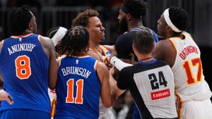 New York Knicks center Mitchell Robinson (23) and Atlanta Hawks guard Dyson Daniels (5) fight in the first half during Game 6 in a first-round NBA basketball playoffs series Thursday, April 30, 2026, in Atlanta. (Brynn Anderson/AP)