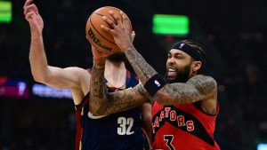 Toronto Raptors forward Brandon Ingram drives on Cleveland Cavaliers forward Dean Wade during the first half in Game 1 of a first-round NBA playoffs basketball series, Saturday, April 18, 2026, In Cleveland. (David Dermer/AP Photo)