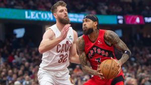 Toronto Raptors' Brandon Ingram (3) looks to shoot as Cleveland Cavaliers' Dean Wade (32) defends during the first half of an NBA basketball game in Cleveland, Thursday, Nov. 13, 2025. (Phil Long/AP Photo)
