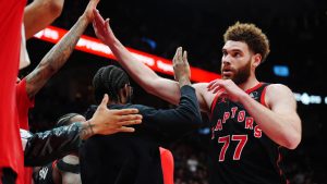 Toronto Raptors' Jamison Battle (77) is congratulated by teammates on the bench during second half NBA playoff basketball action against the Cleveland Cavaliers in Toronto on Thursday, April 23, 2026. (Frank Gunn/CP)