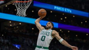 Boston Celtics forward/guard Jayson Tatum scores during the first half in Game 1 of a first-round NBA playoffs basketball game against the Philadelphia 76ers, Sunday, April 19, 2026, in Boston. (Monica Herndon/The Philadelphia Inquirer via AP)
