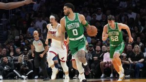 Boston Celtics forward Jayson Tatum (0) moves down the court during the first half of an NBA basketball game against the Miami Heat, Wednesday, April 1, 2026, in Miami. (Lynne Sladky/AP)