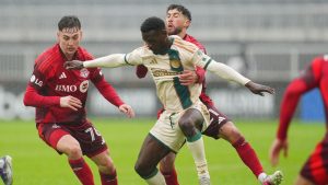 Toronto FC's Lazar Stefanović (76) and Jonathan Osorio (21) battle for the ball with Atlanta United's Emmanuel Latte Lath (9) during first half MLS soccer action in Toronto on Saturday, April 25, 2026. (Frank Gunn/CP)