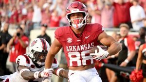 Arkansas tight end Rohan Jones (88) slips past Arkansas State defensive back AG McGhee (6) to score a touchdown during an NCAA football game on Saturday, Sept. 6, 2025, in Little Rock, Ark. (Michael Woods/AP Photo)