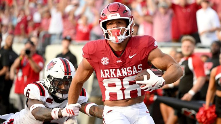 Arkansas tight end Rohan Jones (88) slips past Arkansas State defensive back AG McGhee (6) to score a touchdown during an NCAA football game on Saturday, Sept. 6, 2025, in Little Rock, Ark. (Michael Woods/AP Photo)