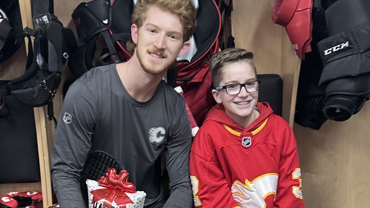 Dustin Wolf, left, and Kade Heisler, right, pose for a picture together. (Eric Francis/Sportsnet)