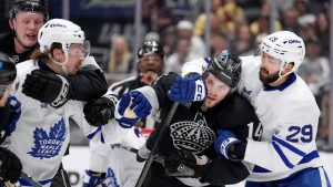Los Angeles Kings centre Samuel Helenius and Toronto Maple Leafs defenceman Simon Benoit scuffle as right wing Alex Laferriere and centre Bo Groulx also scuffle during the second period of an NHL hockey game Saturday, April 4, 2026, in Los Angeles. (Mark J. Terrill/AP)