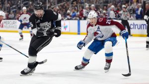 Los Angeles Kings defenceman Cody Ceci, left, moves the puck against Colorado Avalanche center Nathan MacKinnon during the third period of an NHL hockey game Monday, March 2, 2026 in Los Angeles. (Ryan Sun/AP)