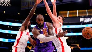 Los Angeles Lakers forward LeBron James passes the ball as Houston Rockets forward Tari Eason and centre Alperen Sengun defend during the first half in Game 5 of a first-round NBA playoffs basketball series Wednesday, April 29, 2026, in Los Angeles. (Mark J. Terrill/AP)