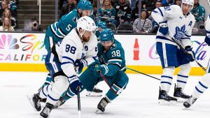 Toronto Maple Leafs right wing William Nylander (88) and San Jose Sharks goaltender Yaroslav Askarov (30) and other players battle for possession during the second period of an NHL hockey game in San Jose, Calif., Thursday, April 2, 2026. (John Hefti/AP)