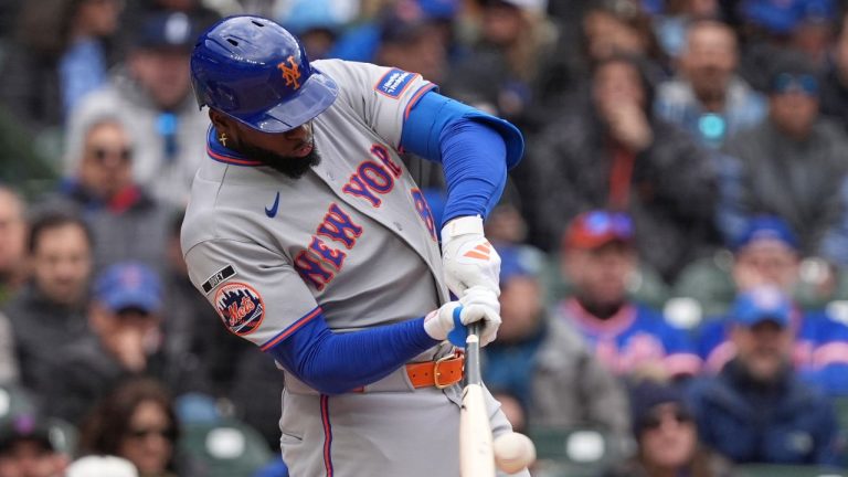 New York Mets' Luis Robert Jr. hits a single during the ninth inning of a baseball game against the Chicago Cubs in Chicago, Sunday, April 19, 2026. (Nam Y. Huh/AP)