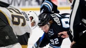 Utah Mammoth centre Logan Cooley (92) and Vegas Golden Knights centre Nic Dowd (26) face-off during the first period of Game 4 of a first-round NHL hockey Stanley Cup playoff series, Monday, April 27, 2026, in Salt Lake City. (Tyler Tate/AP)