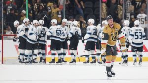 Vegas Golden Knights centre Jack Eichel (9) reacts while Utah Mammoth players celebrate after Utah's victory in Game 2 of a first-round NHL hockey Stanley Cup playoff series Tuesday, April 21, 2026, in Las Vegas. (Ian Maule/AP)