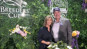 In this image provided by Mark Toothaker, thoroughbred trainer Mark Toothaker and wife Malory pose at the Breeders' Cup in Lexington, Ky., on Oct. 31, 2025. (Courtesy Mark Toothaker via AP)