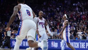 Philadelphia 76ers' Tyrese Maxey, Vj Edgecombe and Paul George celebrate during the second half of Game 6 in a first-round NBA playoff series against the Boston Celtics Thursday, April 30, 2026, in Philadelphia. (AP/Matt Slocum)