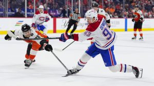 Montreal Canadiens' Ivan Demidov, right, takes a shot past the reach of Philadelphia Flyers' Jacob Gaucher during the first period of an NHL hockey game, Tuesday, April 14, 2026, in Philadelphia. (Derik Hamilton/AP Photo)