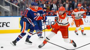 Anaheim Ducks' Leo Carlsson (91) shoots as Edmonton Oilers' Josh Samanski (81) defends during first period NHL playoff action in Edmonton on Wednesday, April 22, 2026. (Codie McLachlan/CP)
