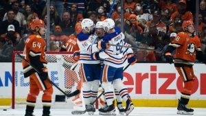 Edmonton Oilers right wing Kasperi Kapanen celebrates his goal with defenceman Jake Walman and right wing Vasily Podkolzin during the first period of Game 4 in the first round of an NHL Stanley Cup playoff series against the Anaheim Ducks, Sunday, April 26, 2026, in Anaheim, Calif. (AP/Kyusung Gong)
