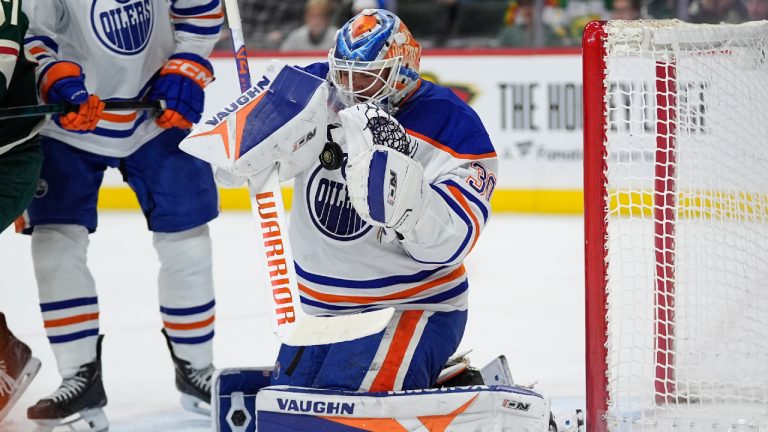 Edmonton Oilers goaltender Calvin Pickard (30) stops a shot during the third period of an NHL hockey game against the Minnesota Wild, Saturday, Dec. 20, 2025, in St. Paul, Minn. (Abbie Parr/AP)