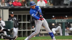 Toronto Blue Jays' Kazuma Okamoto (7) hits a single during the fourth inning of a baseball game against the Chicago White Sox. (Erin Hooley/AP)