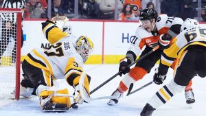 Philadelphia Flyers' Tyson Foerster (71) cannot get a shot past Pittsburgh Penguins' Arturs Silovs (37) and Erik Karlsson (65) during the second period of an NHL hockey game. (Matt Slocum/AP)