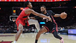 Miami Heat guard Norman Powell (24) drives to the basket as Toronto Raptors forward Scottie Barnes, left, defends during the first half of an NBA basketball game, Monday, Dec. 15, 2025, in Miami. (Lynne Sladky/AP)