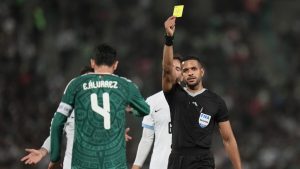 Referee Fernando Moron of Panama shows a yellow card to Mexico's Edson Álvarez during an international friendly soccer match against Uruguay in Torreón, Mexico, Saturday, Nov. 15, 2025. (Eduardo Verdugo/AP)