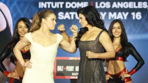 Former UFC champion and Olympic medallist Ronda Rousey, left, faces off with women's combat sports pioneer turned Hollywood star Gina Carano ahead of their main event fight at MVP MMA 1. (Sarah Stier/Getty Images for Netflix)
